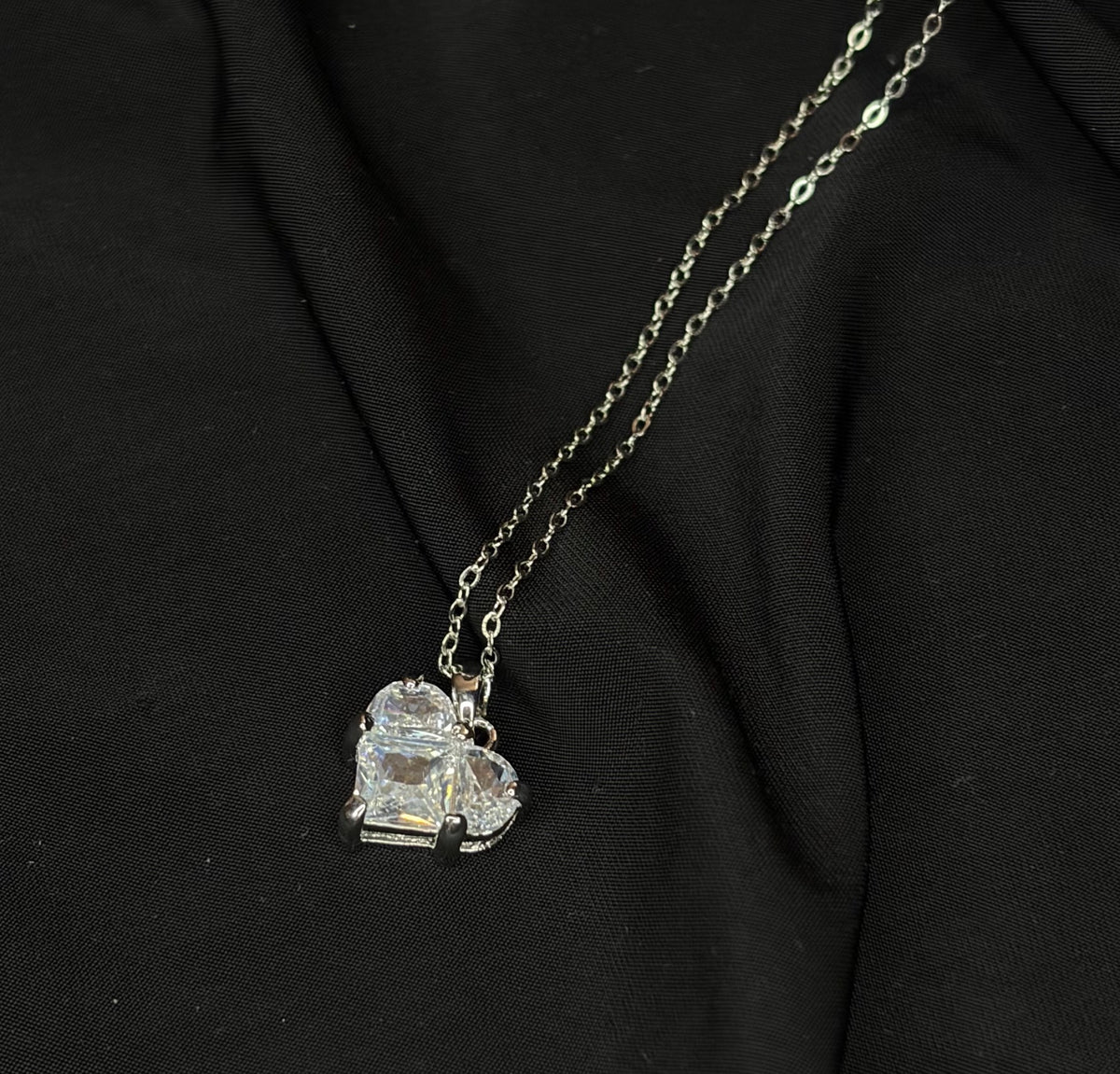 Silver-tone necklace with clear geometric crystal pendant
